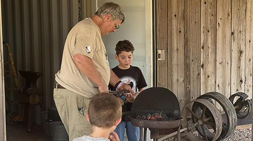 Teaching Boys About Blacksmithing